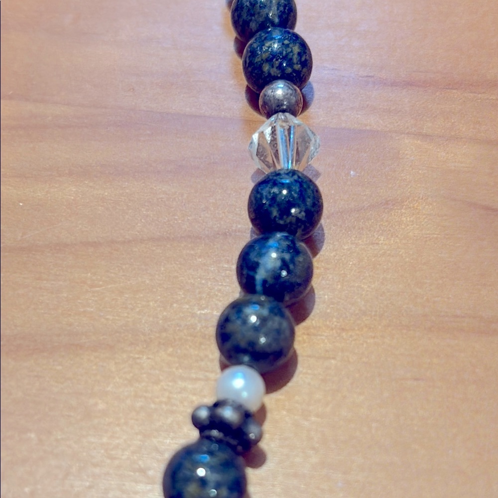 Lapis lazuli necklace with silver and other accent beads.